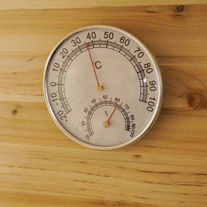 Kivi 4-Person Traditional Outdoor Finnish Home Sauna features a round wall-mounted thermometer/hygrometer. Temperature reads 38–40°C, humidity over 60%, ideal for creating a relaxing sauna environment.