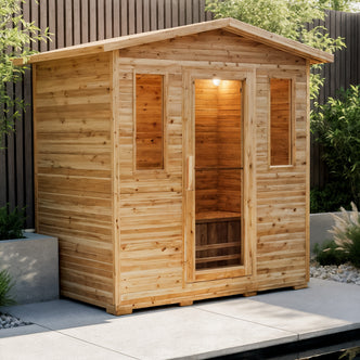 Kivi 4-Person Traditional Outdoor Finnish Home Sauna on a patio, featuring a wooden cabin with glass door, narrow windows, and a simple interior bench, surrounded by greenery.