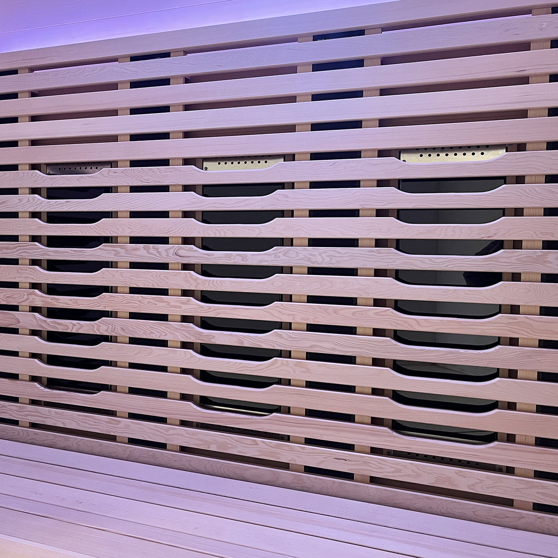 Lue 3 Person Full Spectrum Curved Infrared Indoor Home Sauna showcasing a close-up of sleek horizontal wooden slats with recessed handles, highlighting modern design and craftsmanship in Canadian Hemlock wood.