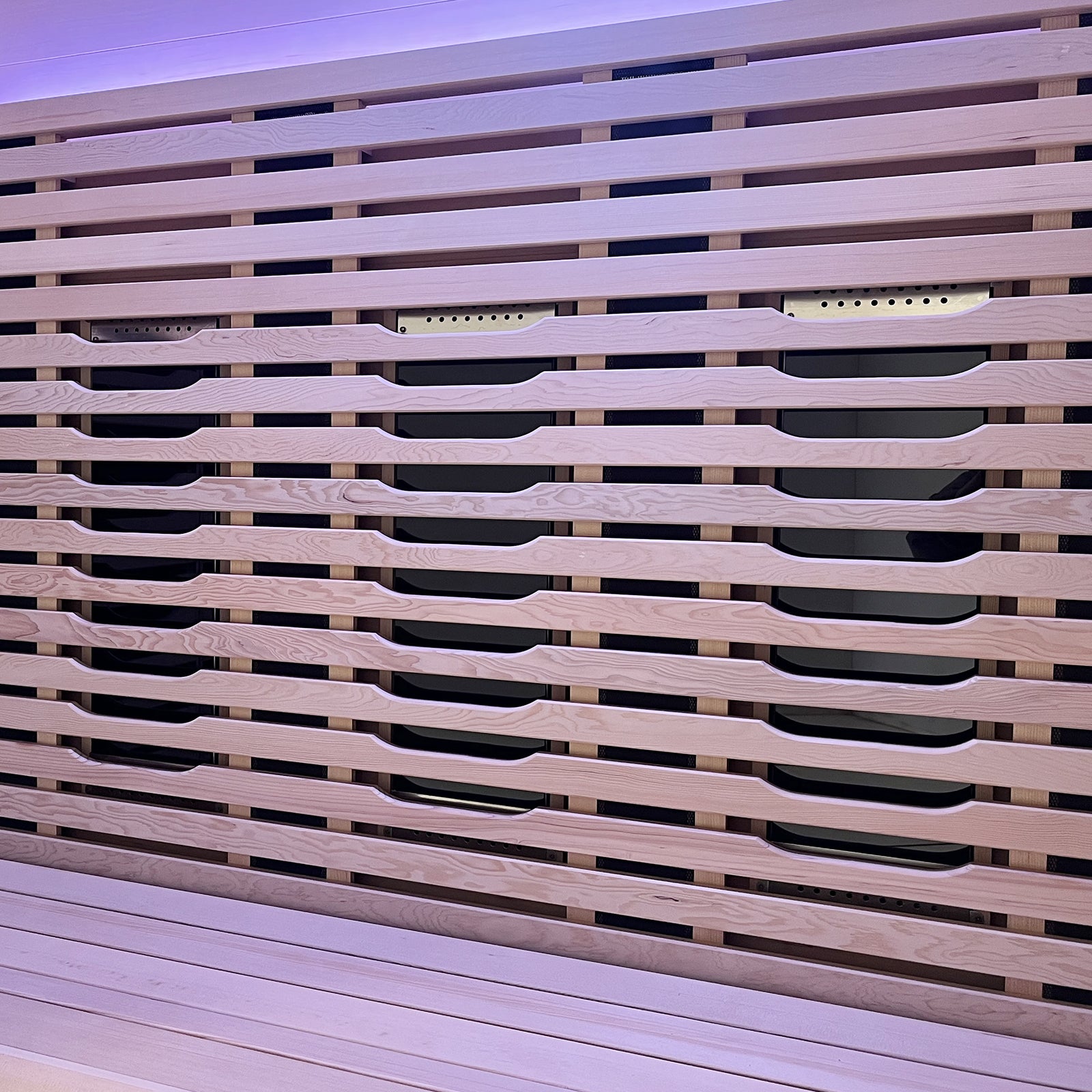Lue 3 Person Full Spectrum Curved Infrared Indoor Home Sauna showcasing a close-up of sleek horizontal wooden slats with recessed handles, highlighting modern design and craftsmanship in Canadian Hemlock wood.
