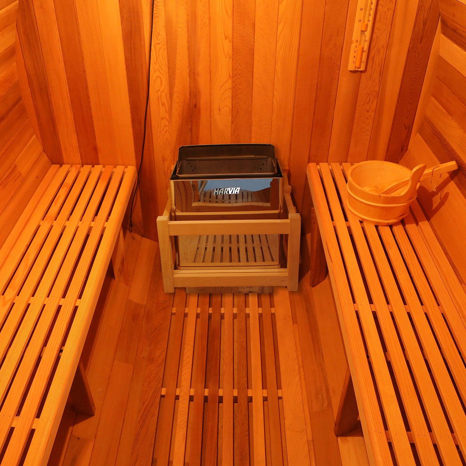 Luola 4-Person Red Cedar Outdoor Barrel Sauna with 8kW Heater, featuring sturdy wooden slats and a spacious bench, perfect for backyard relaxation and wellness.