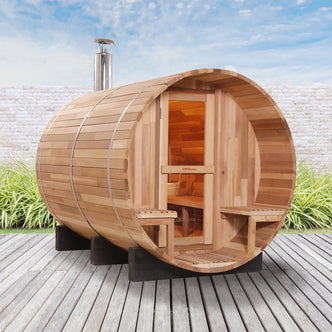 Luola 4-Person Red Cedar Barrel Sauna with Wood Stove on a deck, showcasing its classic wooden barrel design and durable red cedar construction, ideal for outdoor relaxation and wellness.