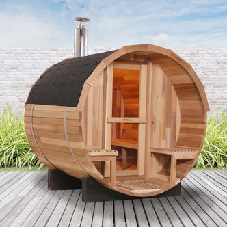 Luola 2-Person Red Cedar Outdoor Barrel Sauna with Wood Stove, showcasing its wooden barrel shape, Red Cedar construction, and outdoor placement, offering a cozy retreat for wellness and relaxation.