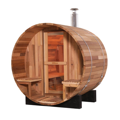 Luola 2-Person Red Cedar Outdoor Barrel Sauna with Wood Stove; wooden barrel shape, wooden benches inside, crafted from red cedar, designed for couples' relaxation in an outdoor setting.