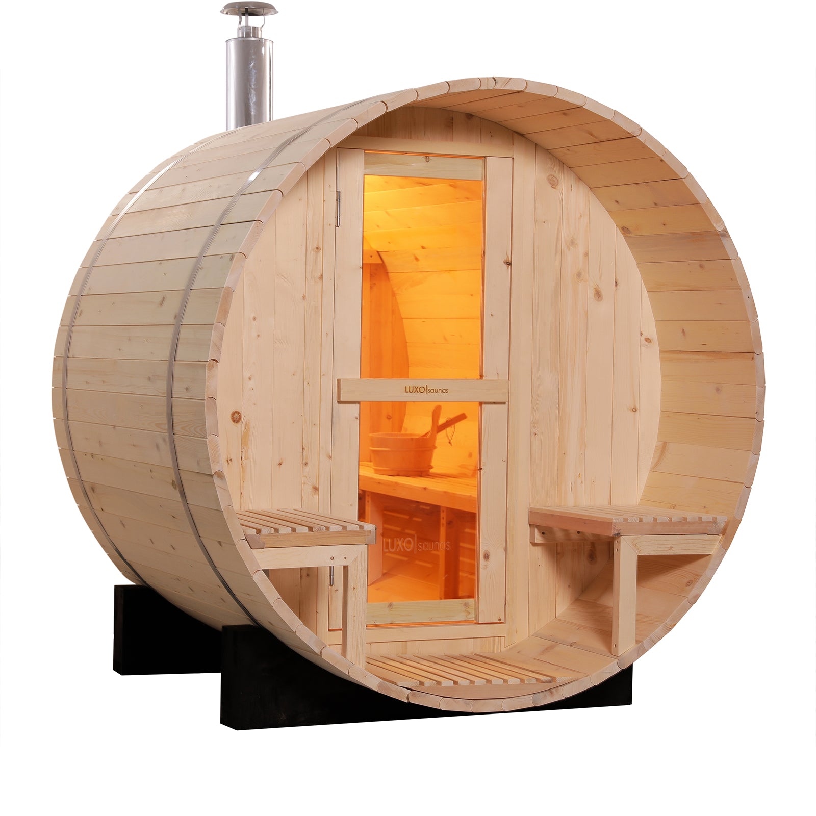 Luola 2 Person Pine Outdoor Barrel Sauna & Wood Stove, featuring a light knotty wood barrel shape, glass-paneled door, stovepipe chimney, and visible interior wooden bucket and ladle.