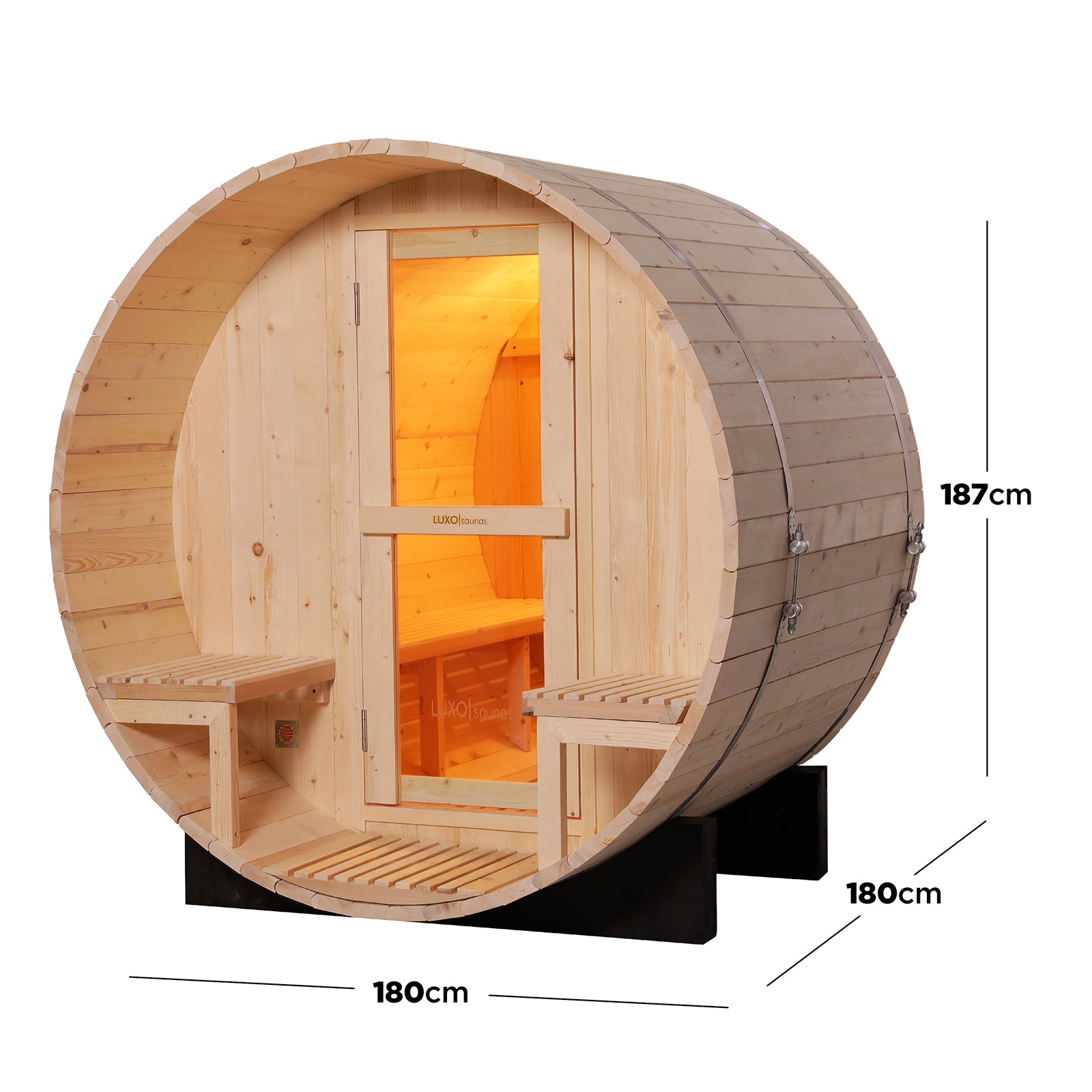 Luola 2 Person Pine Outdoor Barrel Sauna & Wood Stove: Barrel-shaped sauna with tongue-and-groove wood staves, glazed door, small deck, wooden slat benches, and softly lit interior with built-in seating.
