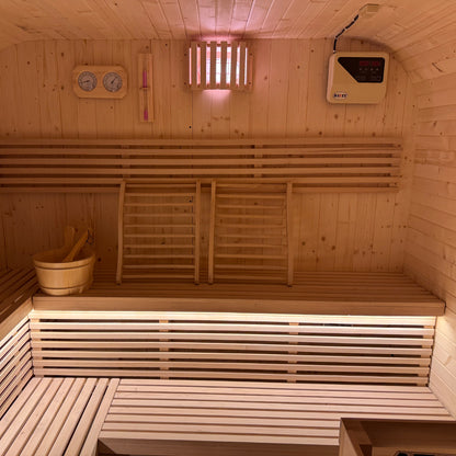 Medika 8 Person Traditional Finnish Outdoor Sauna with a sleek design, featuring a close-up of its vent, wooden ladder against the wall, showcasing its robust construction for an authentic wellness experience.