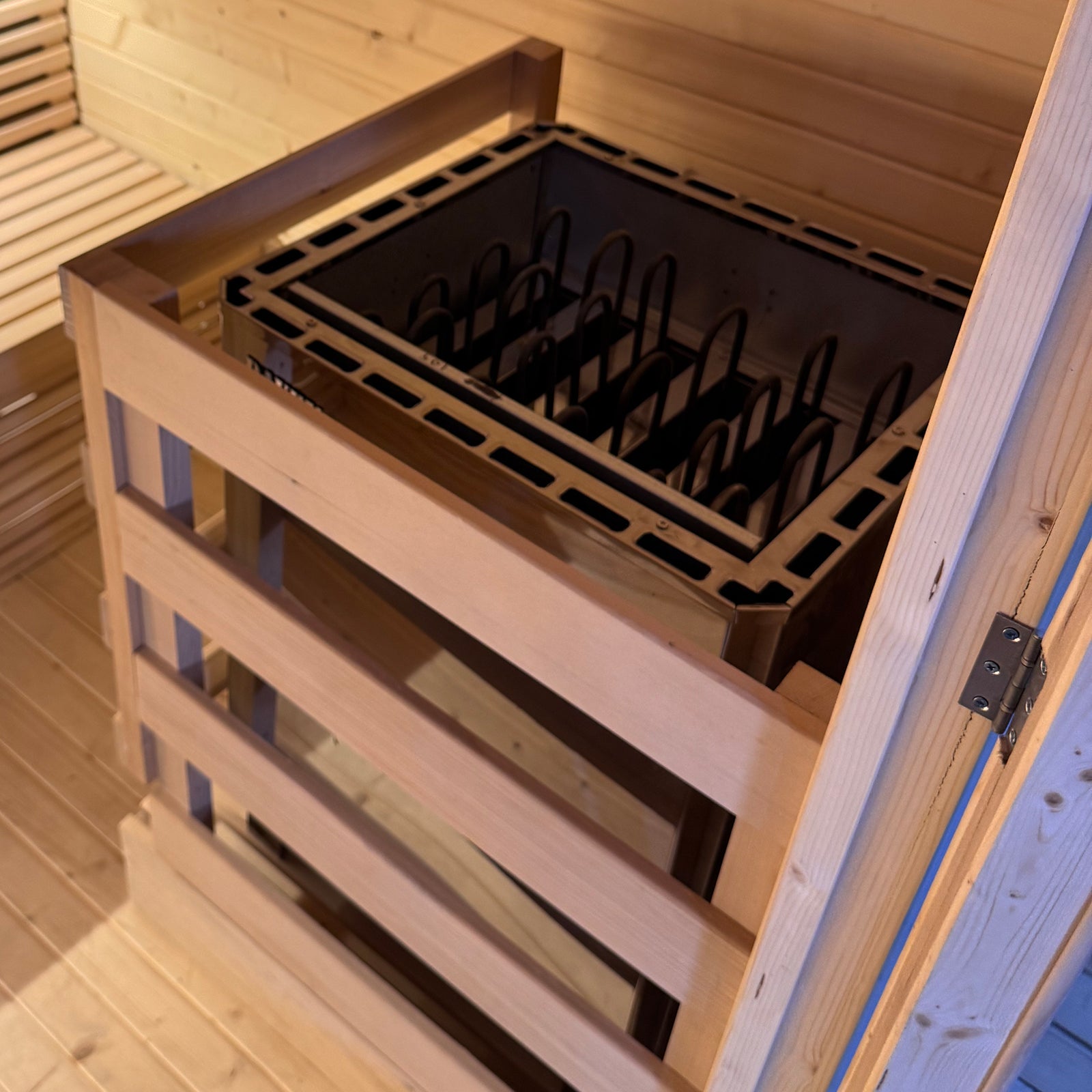 Medika 8 Person Traditional Finnish Outdoor Sauna featuring fir wood construction, tempered glass door, and window; highlights two-level wooden benches inside a spacious sauna, ideal for relaxation and wellness.