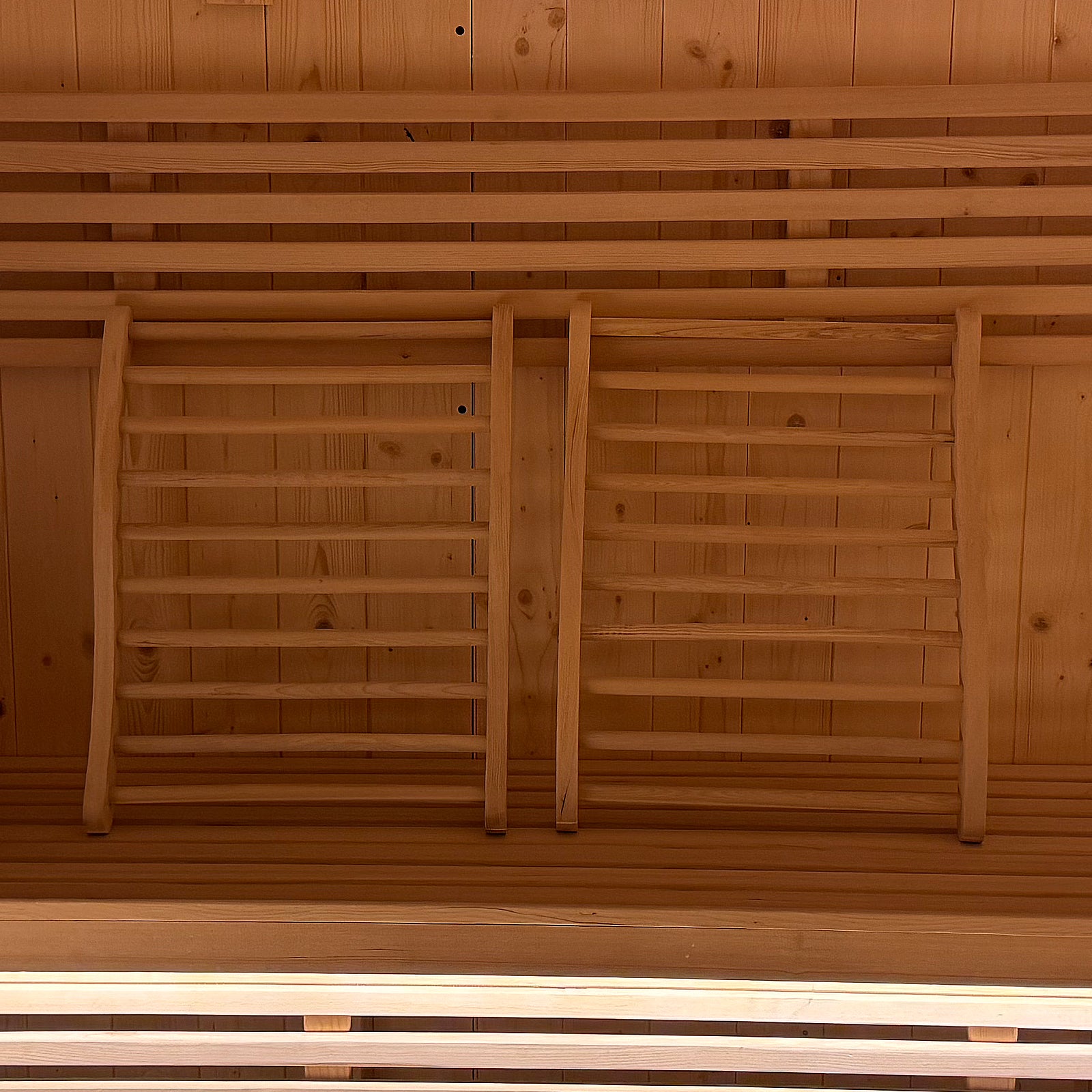 Medika 8 Person Traditional Finnish Outdoor Sauna featuring a close-up of durable wooden slats and a robust wooden ladder, showcasing its sturdy construction designed for outdoor relaxation and heat therapy.