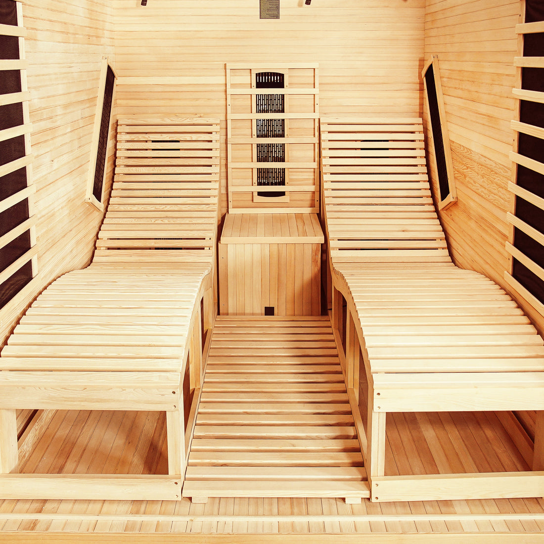 Metsa 3 Person Hybrid Carbon Fibre Infrared Home Sauna with wood-slatted reclining benches, dark infrared heater panels, and a central wooden step, offering a spacious and comfortable indoor sauna experience.