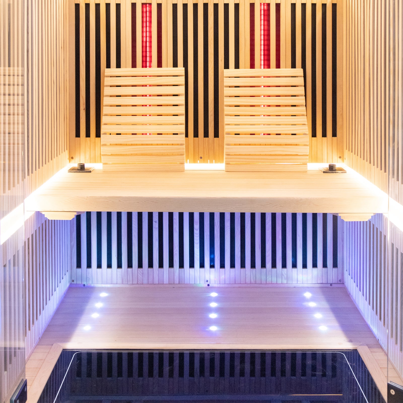 Runko 2 Person Canadian Hemlock Carbon Fibre Infrared Sauna showcasing close-up details of its wooden slat construction and interior surface, highlighting the craftsmanship and design suitable for indoor relaxation.
