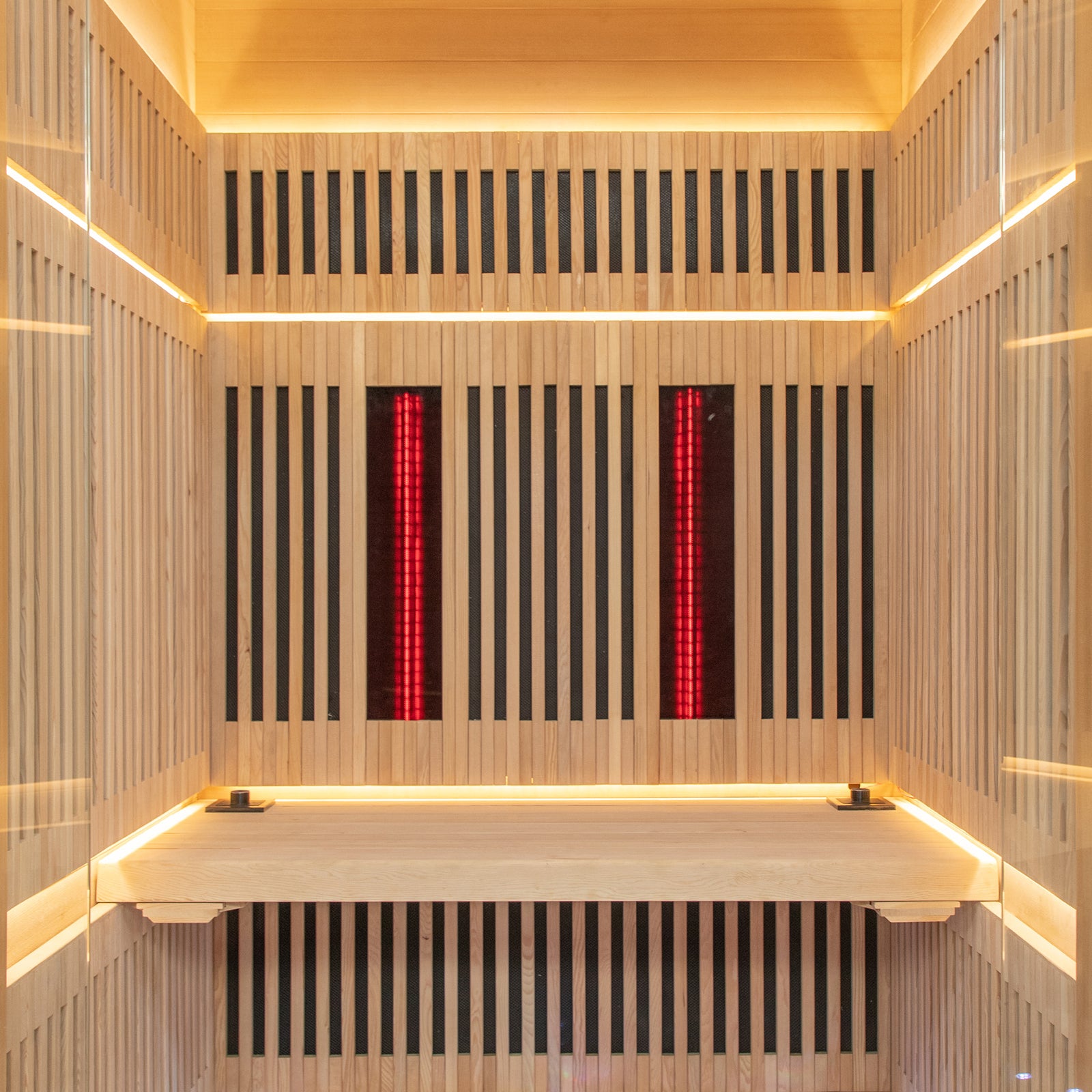 Close-up of the Runko 2 Person Canadian Hemlock Carbon Fibre Infrared Sauna, featuring sleek wood paneling and modern design elements, ideal for enhancing indoor spaces with comfort and style.