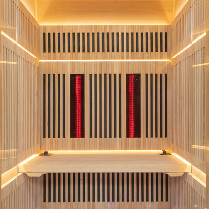 Close-up of the Runko 2 Person Canadian Hemlock Carbon Fibre Infrared Sauna, featuring sleek wood paneling and modern design elements, ideal for enhancing indoor spaces with comfort and style.