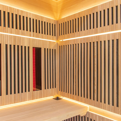 Close-up of Runko 2 Person Canadian Hemlock Carbon Fibre Infrared Sauna, highlighting its sleek wood paneling and interior design, featuring corner details and integrated lighting for a serene indoor experience.