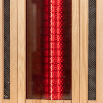 Runko 2 Person Canadian Hemlock Carbon Fibre Infrared Sauna featuring a sleek wood surface, visible red light elements within a wood box and on a glass surface, highlighting modern design and functionality.