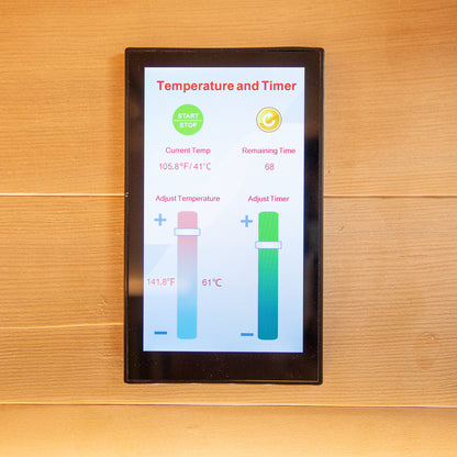 Runko 2 Person Canadian Hemlock Carbon Fibre Infrared Sauna with a visible tablet computer interface and sleek wood surface, showcasing its modern design and technological features.
