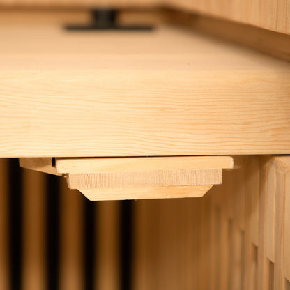 Close-up of the Runko 2 Person Canadian Hemlock Carbon Fibre Infrared Sauna, highlighting its smooth wooden surface and craftsmanship, emphasizing the quality of the hemlock wood used in its construction.