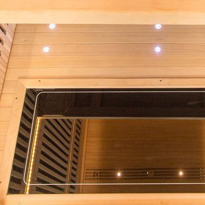 Runko 2 Person Canadian Hemlock Carbon Fibre Infrared Sauna featuring a close-up of its sleek wood panels and building structure, showcasing a smooth wood surface ideal for indoor relaxation.