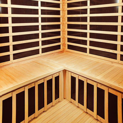 Taavi 4 Person Corner Carbon Fibre Far Infrared Home Sauna interior featuring wooden bench seating, slatted paneling, and visible carbon fibre heating elements, highlighting its spacious design and infrared technology for home relaxation.