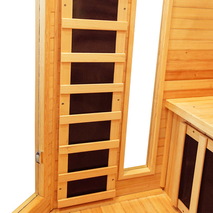 Inside corner view of the Taavi 4 Person Corner Carbon Fibre Far Infrared Home Sauna, showing vertical black heater panels, a wooden bench, and wooden walls, offering a spacious, luxurious home sauna experience.