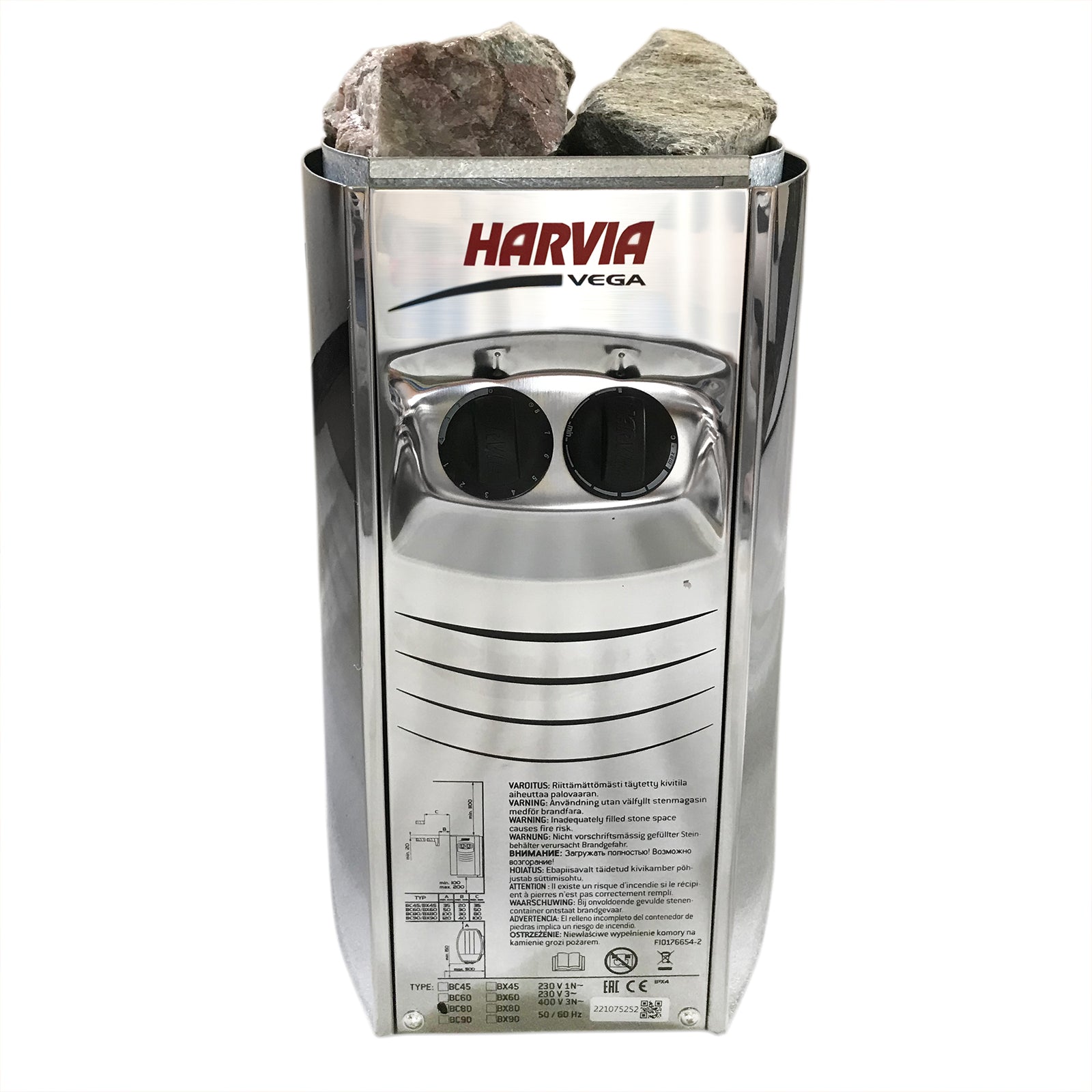 Tarve 3 Person Canadian Hemlock Sauna with Harvia Stove: close-up of sauna's robust hemlock wood, highlighting craftsmanship, surrounded by sauna rocks, emphasizing traditional design and quality.