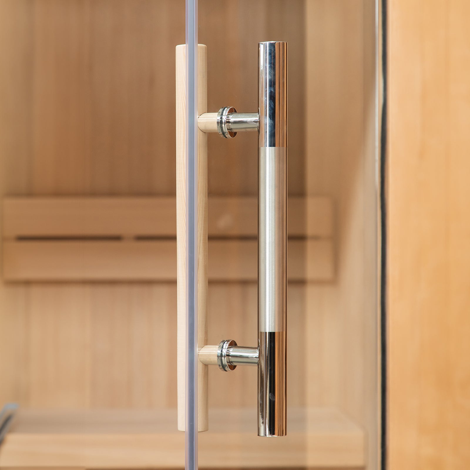 Tarve 3 Person Canadian Hemlock Sauna with Harvia Stove featuring a wooden interior and visible metal pole, suggesting sturdy construction. Smoke from the window indicates the stove's active heating function.