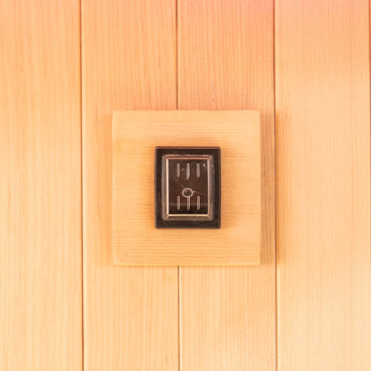 Close-up of the Tarve 3 Person Canadian Hemlock Sauna with Harvia Stove, highlighting the smooth, rectangular wooden surface crafted from premium hardwood, showcasing its elegant, natural finish and sturdy construction.