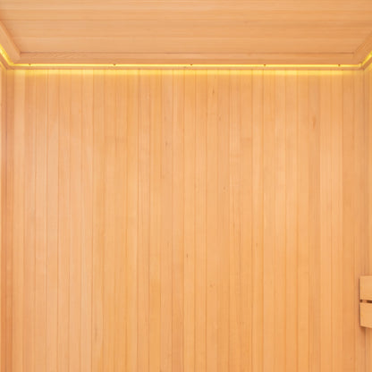 The Tarve 3 Person Canadian Hemlock Sauna with Harvia Stove features a sleek indoor design with smooth hardwood surfaces highlighted by a light strip, showcasing exquisite craftsmanship and varnished plywood elements.