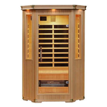 Tukeva 2 Person Carbon Fibre Infrared Sauna – Hemlock: Close-up of the sauna's wooden structure with a modern glass door, showcasing its spacious interior, chromotherapy lights, and sleek design for home wellness.