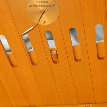 Tukeva 2 Person Carbon Fibre Infrared Sauna – Hemlock: Close-up of its sturdy Canadian Hemlock finish with digital controls, showcasing the compact, portable design ideal for home wellness.