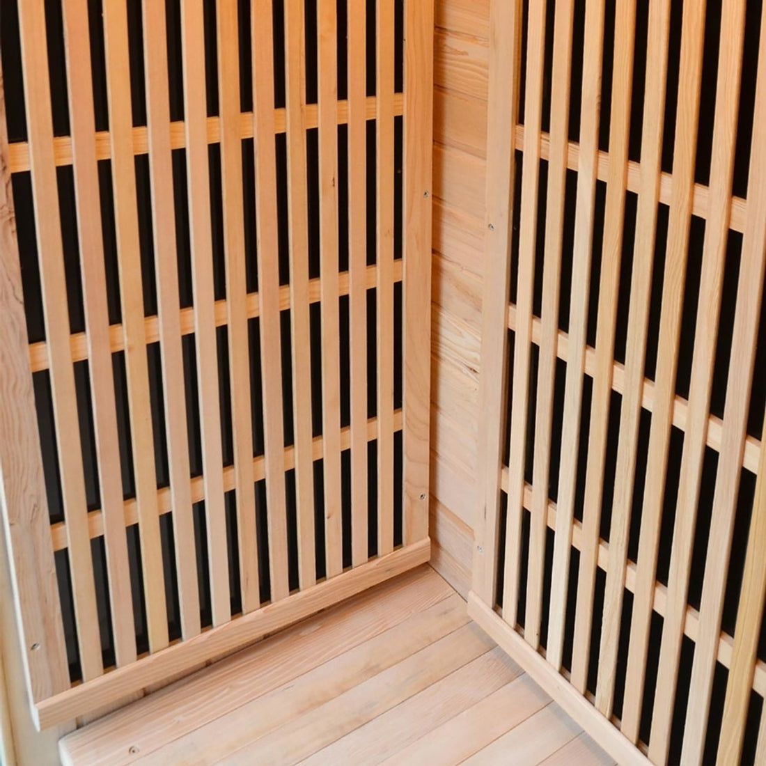 Close-up of the Tumma 2-Person Carbon Fibre Infrared Home Sauna, featuring Canadian hemlock wood construction with visible wooden slats, highlighting its craftsmanship and robust design.