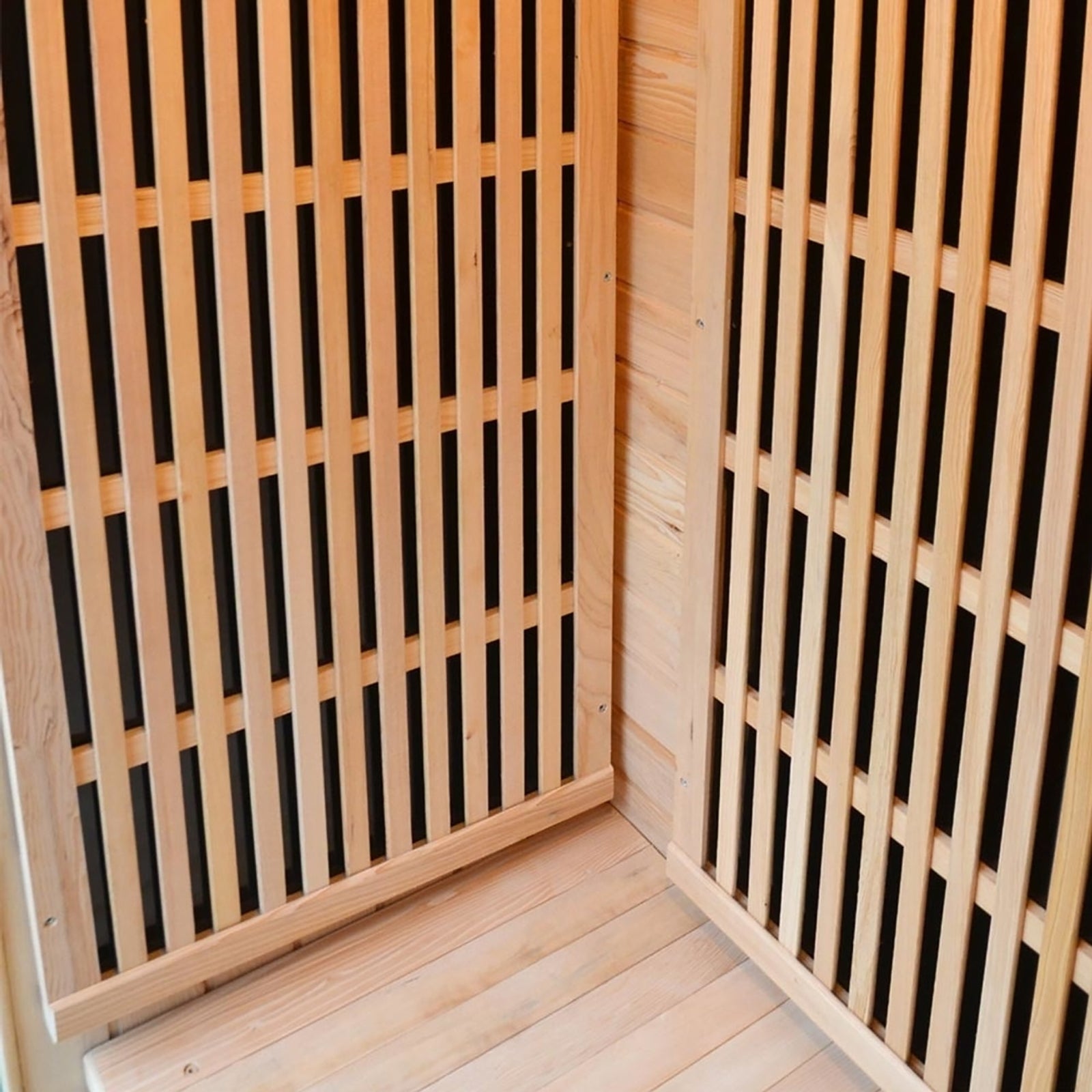 Close-up of the Tumma 2-Person Carbon Fibre Infrared Home Sauna, featuring Canadian hemlock wood construction with visible wooden slats, highlighting its craftsmanship and robust design.
