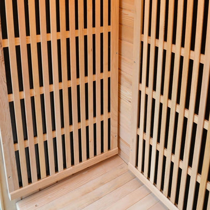 Close-up of the Tumma 2-Person Carbon Fibre Infrared Home Sauna, featuring Canadian hemlock wood construction with visible wooden slats, highlighting its craftsmanship and robust design.