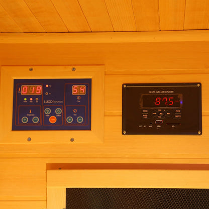 Tumma 2-Person Carbon Fibre Infrared Home Sauna, showcasing a sleek digital control panel and elegant Canadian hemlock wood finish, enhancing relaxation with advanced infrared technology for optimal wellness.