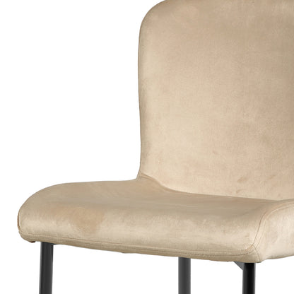 Adela Velvet Fabric Dining Chair Set of 2 in Oatmeal, featuring a light beige upholstered seat and backrest with slender black metal legs, showcasing a modern, minimalist design ideal for dining spaces.