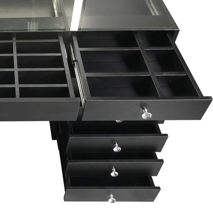 Adeline Makeup Vanity Table with LED Mirror in Black features a top glass lid, two shallow drawers with small compartments, and four deeper drawers with crystal-style knobs, all empty.