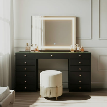 Adeline Makeup Vanity Table with LED Mirror in Black features a sleek design with spacious storage, warm LED-lit mirror, arranged cosmetics, and a plush ottoman stool, perfect for a chic beauty setup.