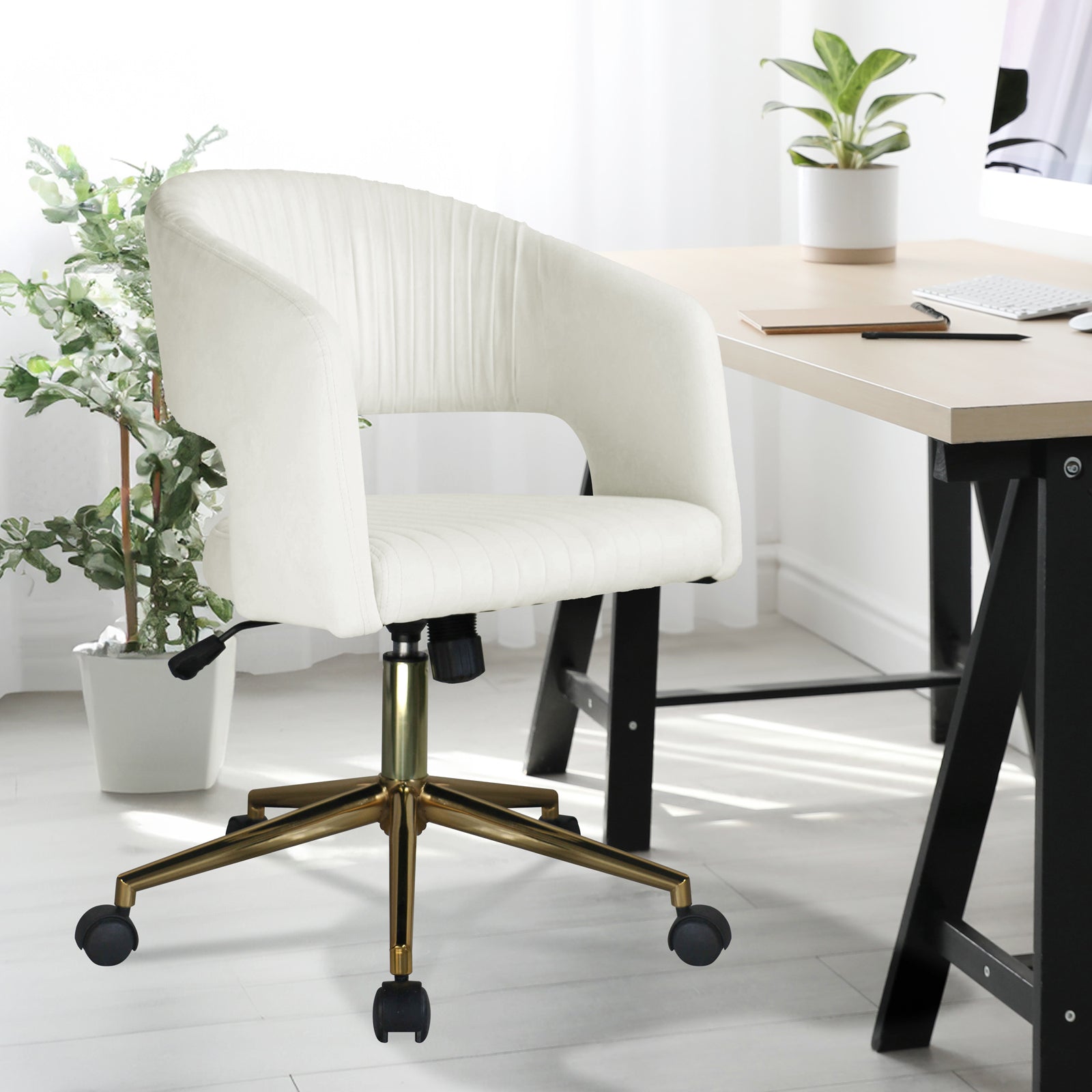 Afina Curved Adjustable Paneled Velvet Swivel Office Chair in a sleek, modern design with a plush seat and backrest, showcased near a white pot plant and furniture, highlighting its stylish appeal.