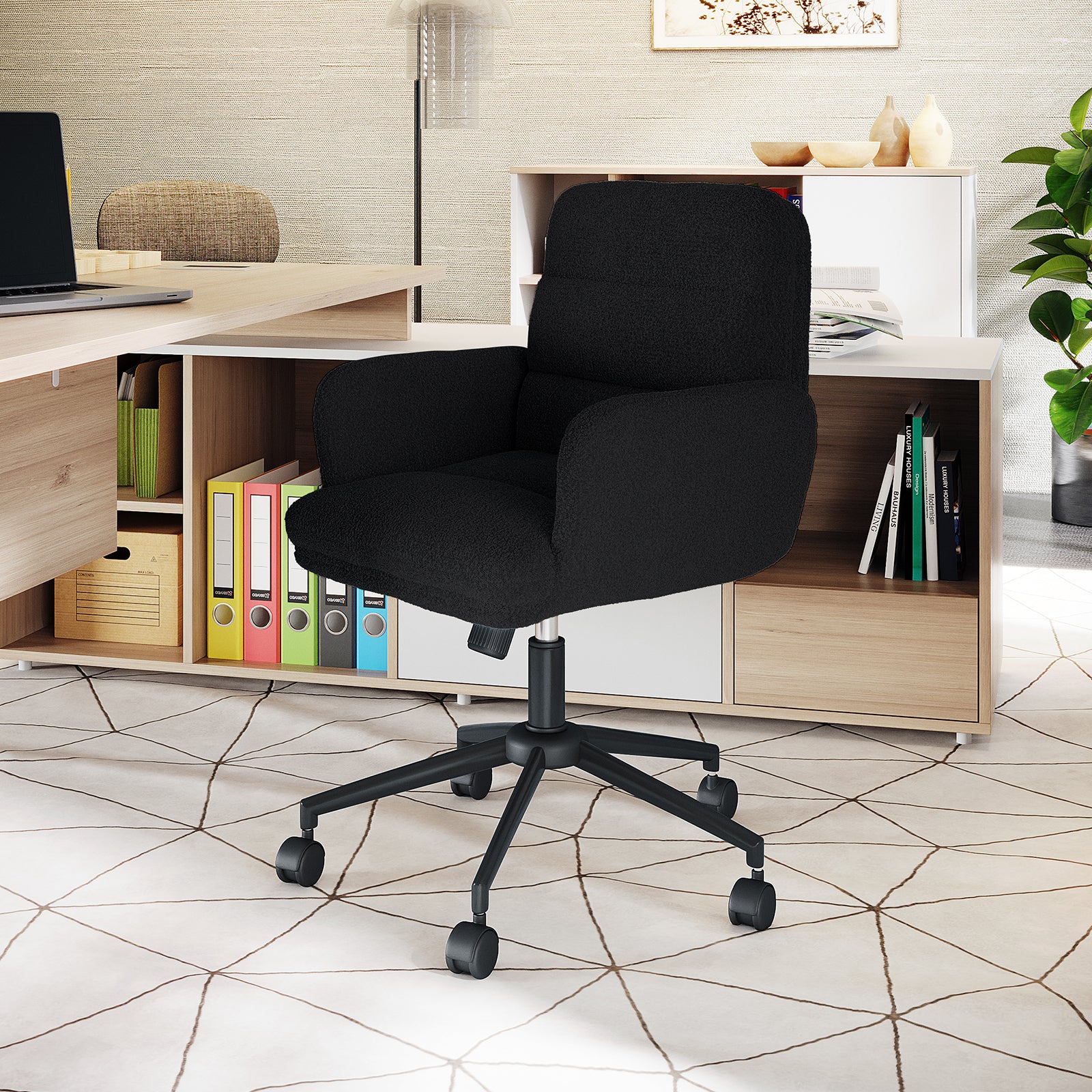 Aglaya Boucle Swivel Office Chair – Black | Luxo Living, featuring a sleek design with ergonomic padded seat, boucle upholstery, and sturdy metal base with castor wheels, placed in an office setting.