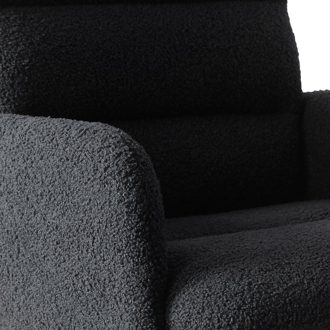 Close-up of the Luxo Aglaya Boucle Swivel Office Chair in Black, showcasing its curved armrest, seat cushion, and back, all covered in plush, textured boucle fabric for a chic and comfortable design.