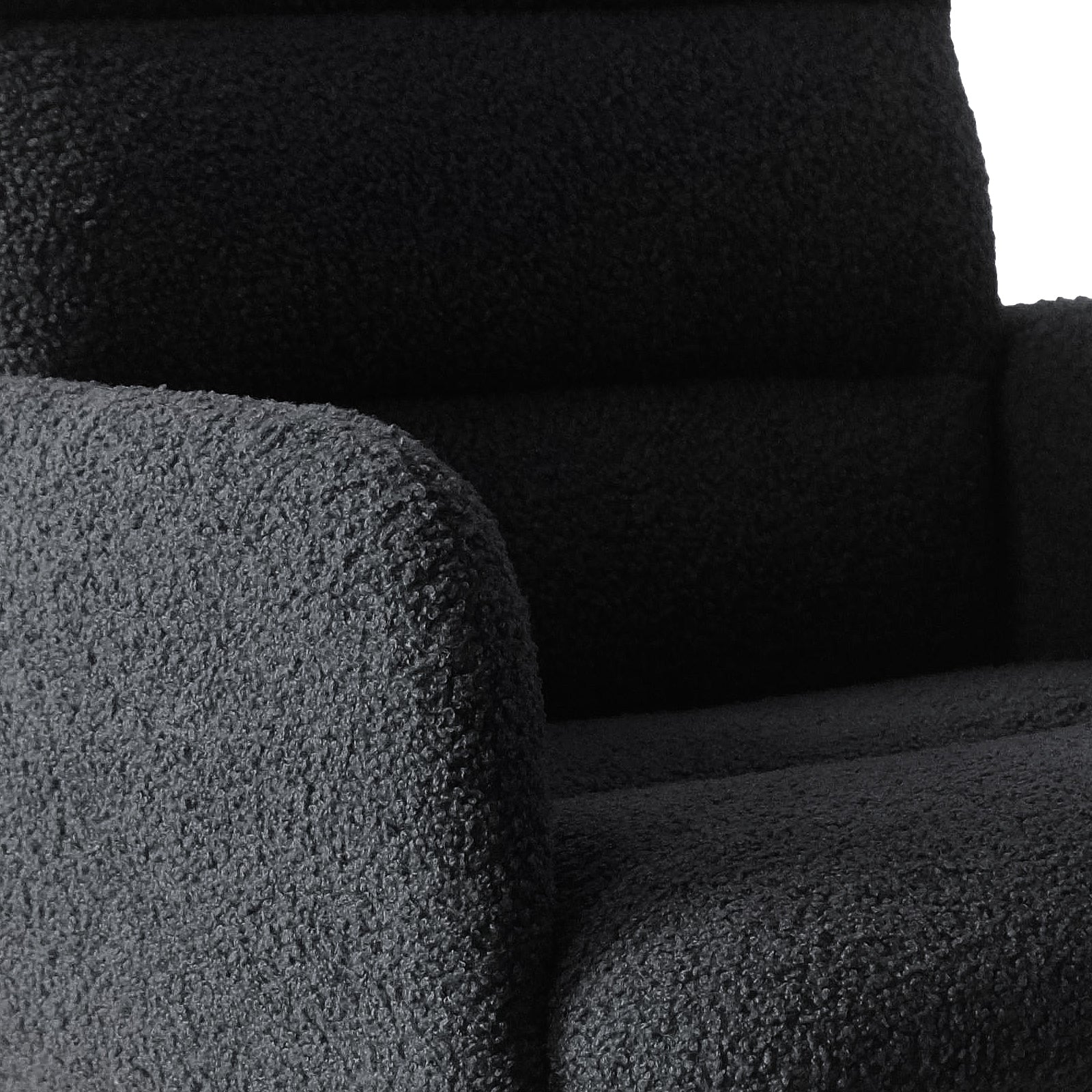 Close-up of the Luxo Aglaya Boucle Swivel Office Chair in Black, showcasing its curved armrest, seat cushion, and back, all covered in plush, textured boucle fabric for a chic and comfortable design.