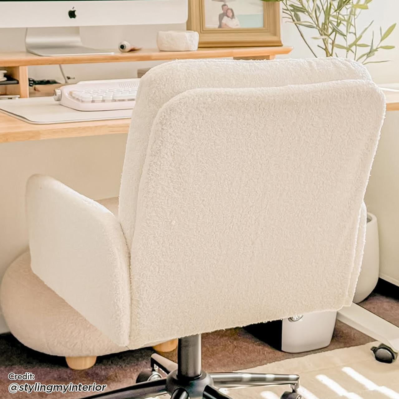 Luxo Aglaya Boucle Swivel Office Chair in Cream White, featuring plush boucle fabric, padded arms, and a five-star caster base, positioned before a light wood desk with Apple iMac.