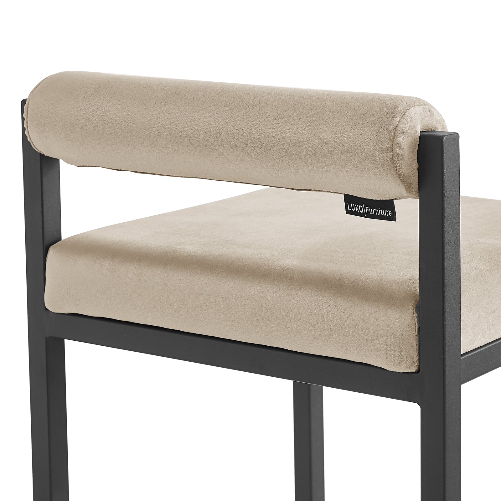 Close-up of the Aivy Velvet Bar Stool - Set of 2, showcasing the plush foam padding and sleek black metal frame with a built-in footrest, embodying modern design and comfort.