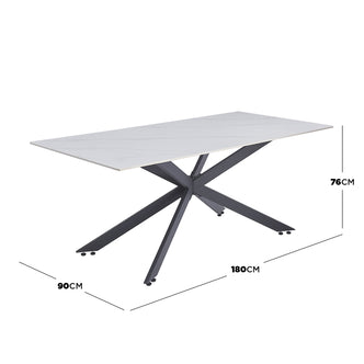 Alfred 180cm Modern Pedestal Dining Table - White Marble features a light-colored marble-effect top and a sculptural black steel base, offering stylish elegance and ample legroom for six people.