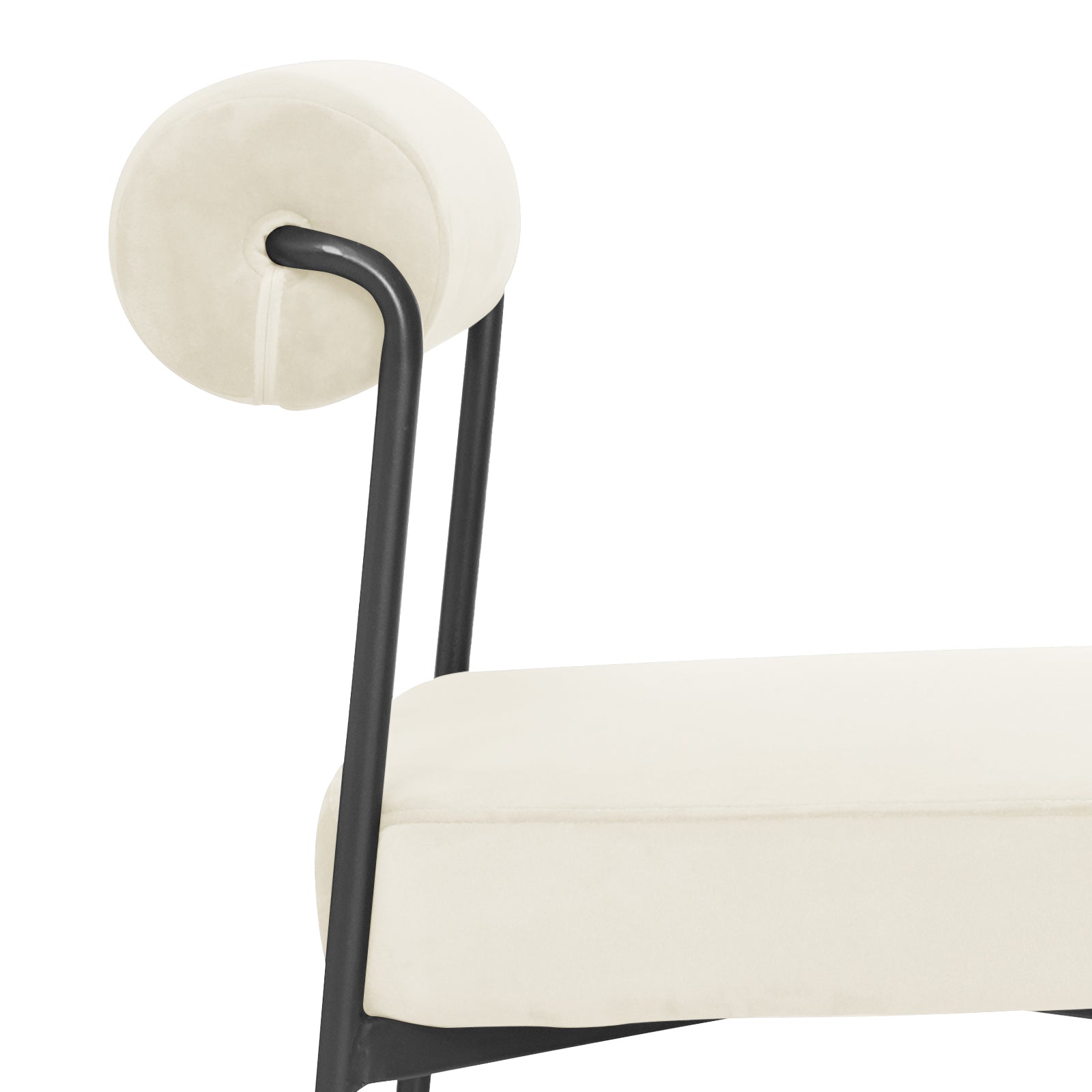 Close-up of the Alona Modern Velvet Dining Chair Set of 2 in Cream White, showcasing a cream cushion on a sleek black metal frame with a matching cylindrical bolster attached by curved rods.