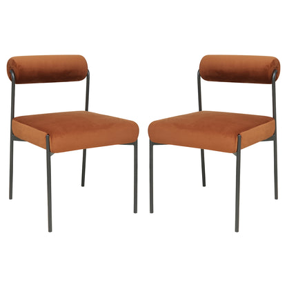 Alona Modern Velvet Dining Chair Set of 2 in Terracotta, featuring rust-orange velvet upholstery, curved cylindrical backrests, and square seats on slim, black metal legs, offering a sleek, modern look.