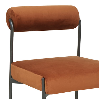 Alona Modern Velvet Dining Chair Set of 2 in Terracotta, featuring a plush rust-orange upholstered seat and cylindrical back, supported by a sleek dark metal frame, showcasing modern elegance and comfort.