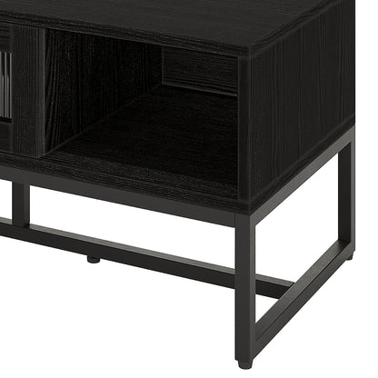 Ashley Coffee Table with Fluted Glass Door in Black, featuring a modern rectangular wood-grain top, open cubby, and sleek black metal frame, ideal for contemporary living spaces.
