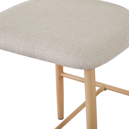 Audrey Curved Linen Barstool Set of 2 in Beige features a light-beige, upholstered seat with slender, light-wood legs and cross-bracing bars, combining elegance and comfort for modern kitchens or bars.