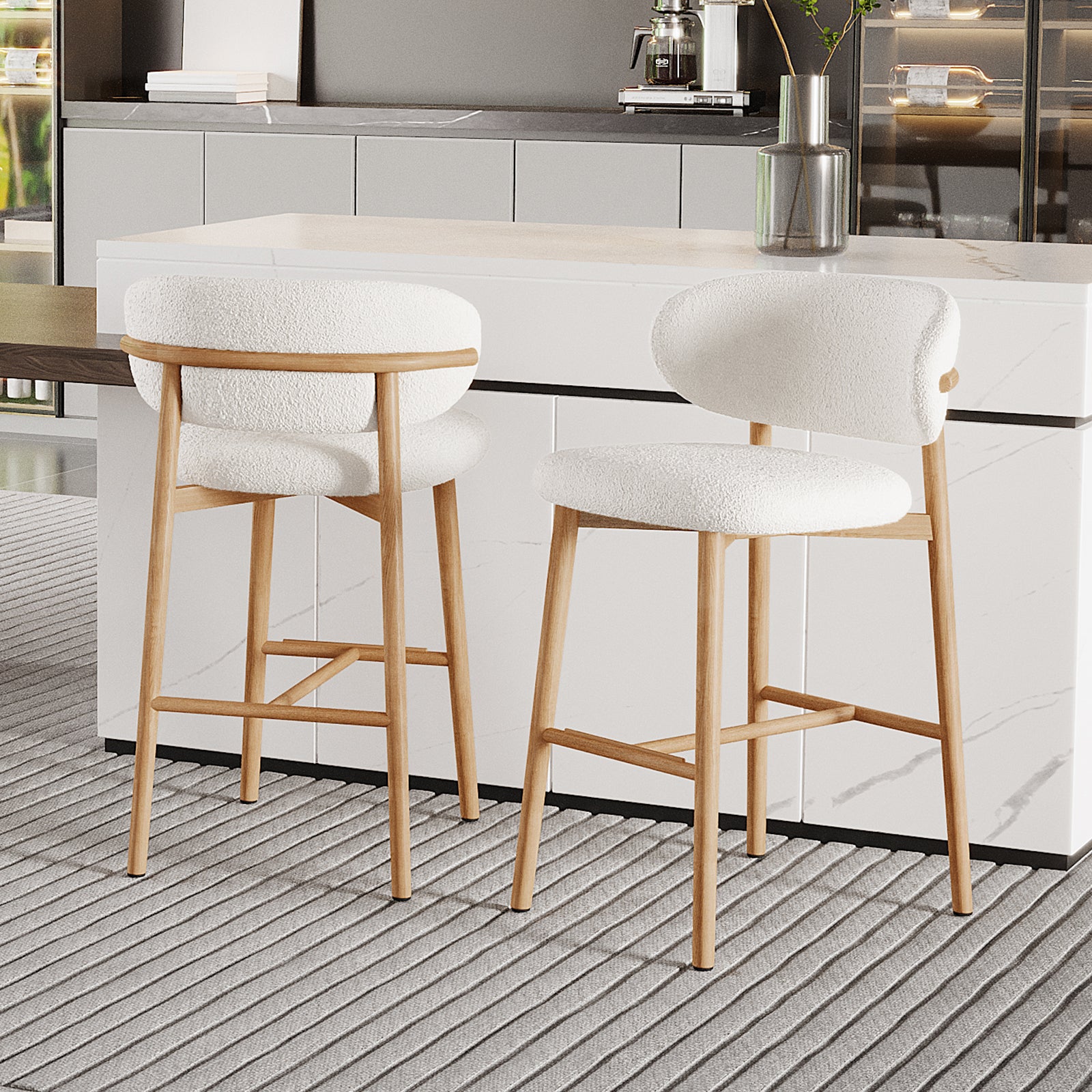 Audrey Curved Boucle Barstool Set of 2 in Cream White features light wood frames and plush upholstered seats, set against a modern kitchen with a marble-effect countertop and stainless steel accessories.